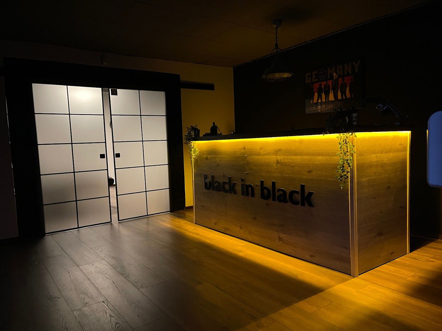 a wooden counter with a sign that says black