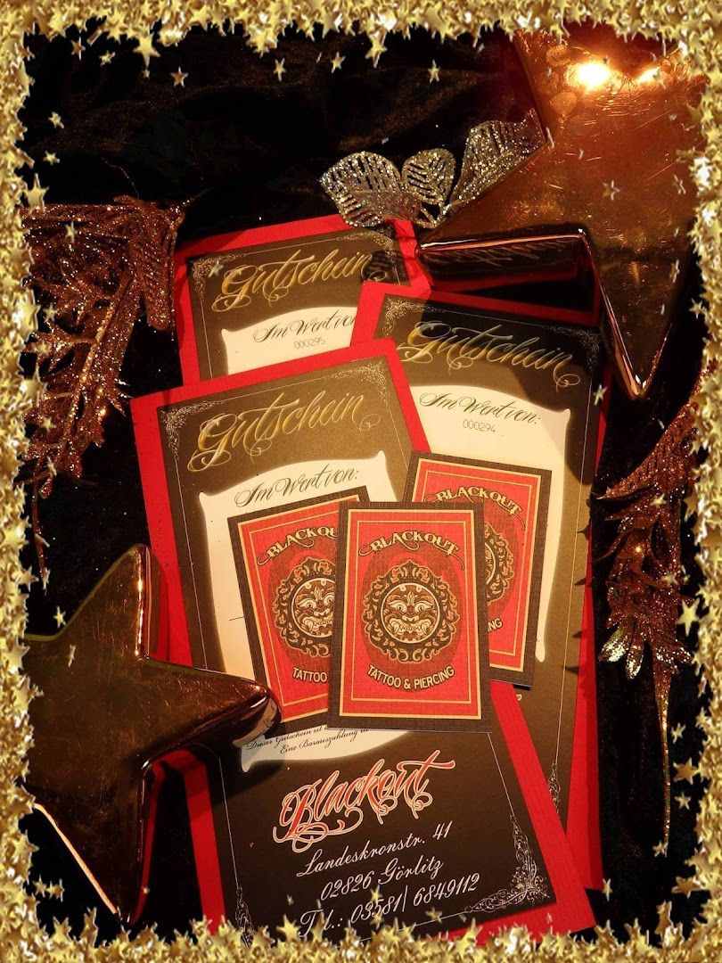 a box of chocolates with a red and gold foil foil