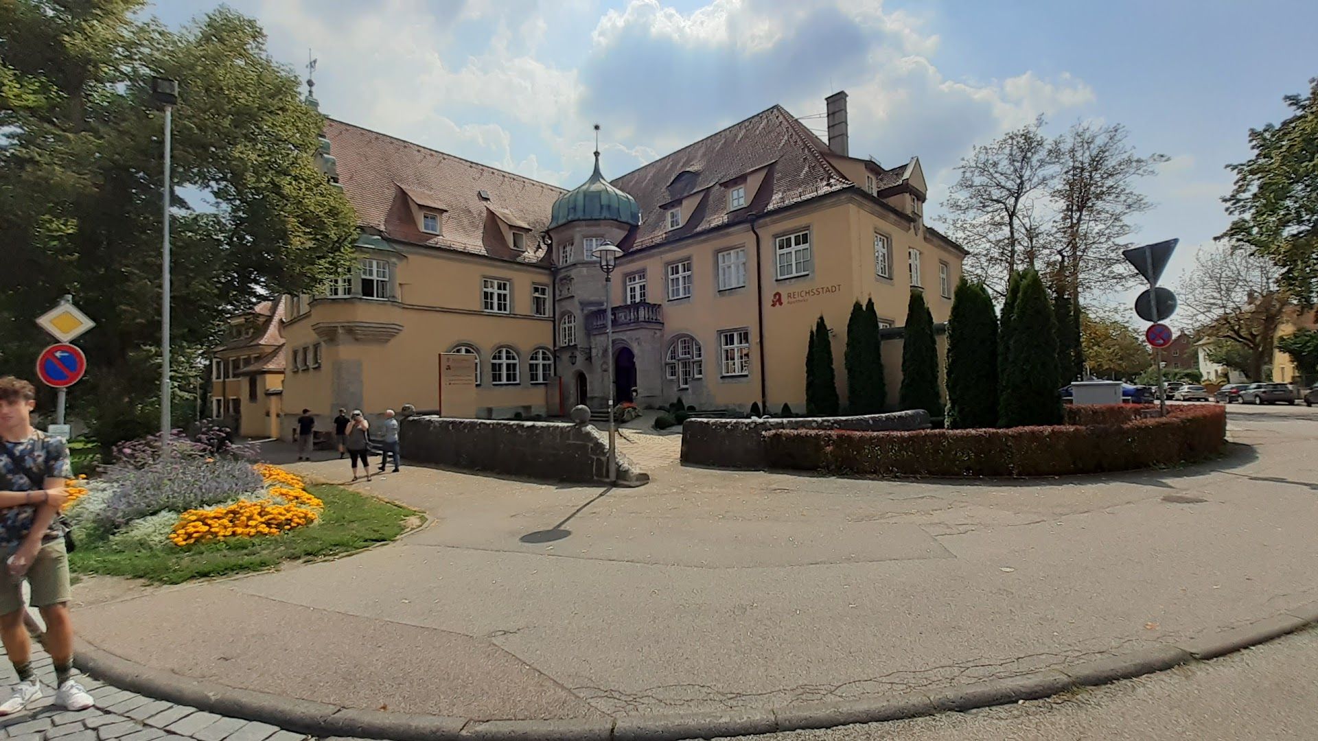 a person is walking in front of a house