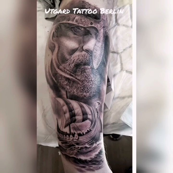 a man's arm with a cover-up tattoo of a man's face and a skull, oberhavel, germany