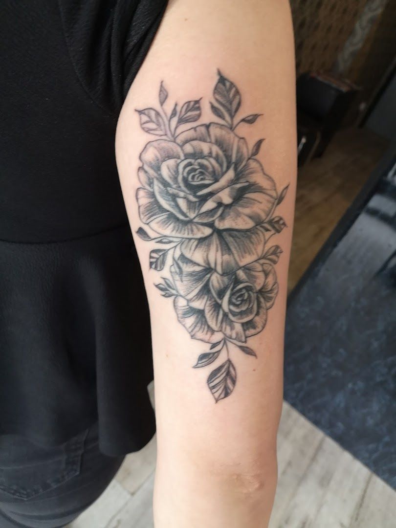 a black and white rose cover-up tattoo on the arm, havelland, germany