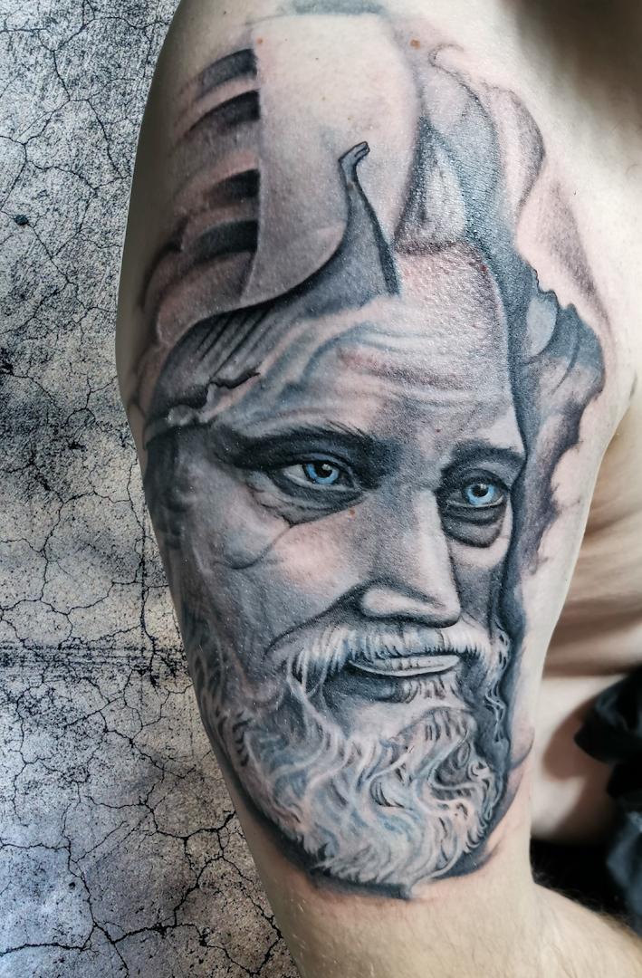 a man with a beard and a beard on his arm