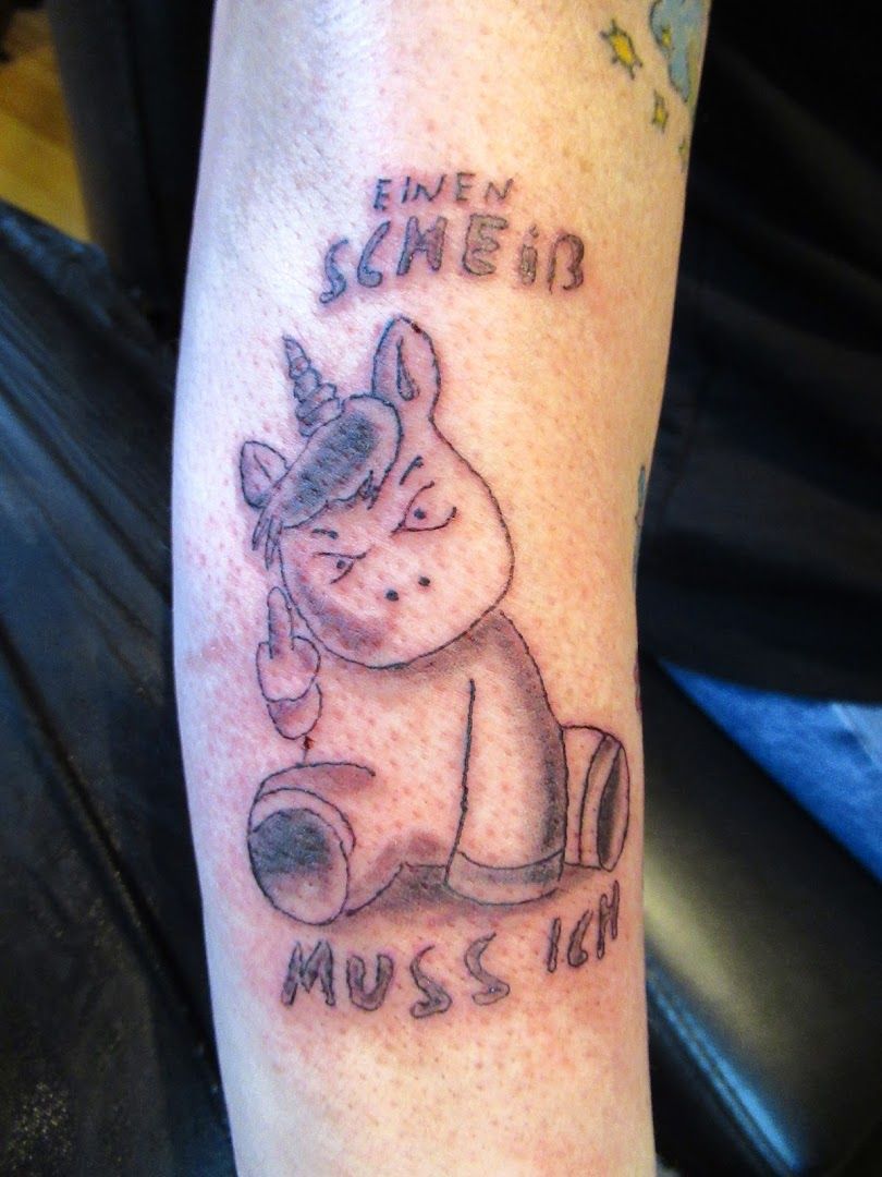 a narben tattoo of a unicorn with the words'be like me ', ammerland, germany