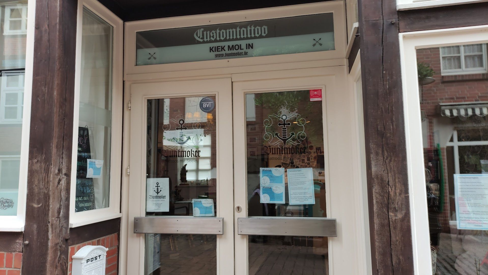 the entrance to the restaurant, with a sign on the door