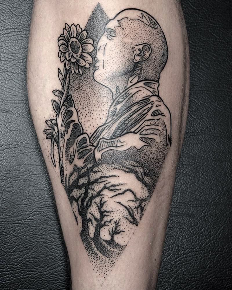 a narben tattoo of a man with a flower in his hand, passau, germany