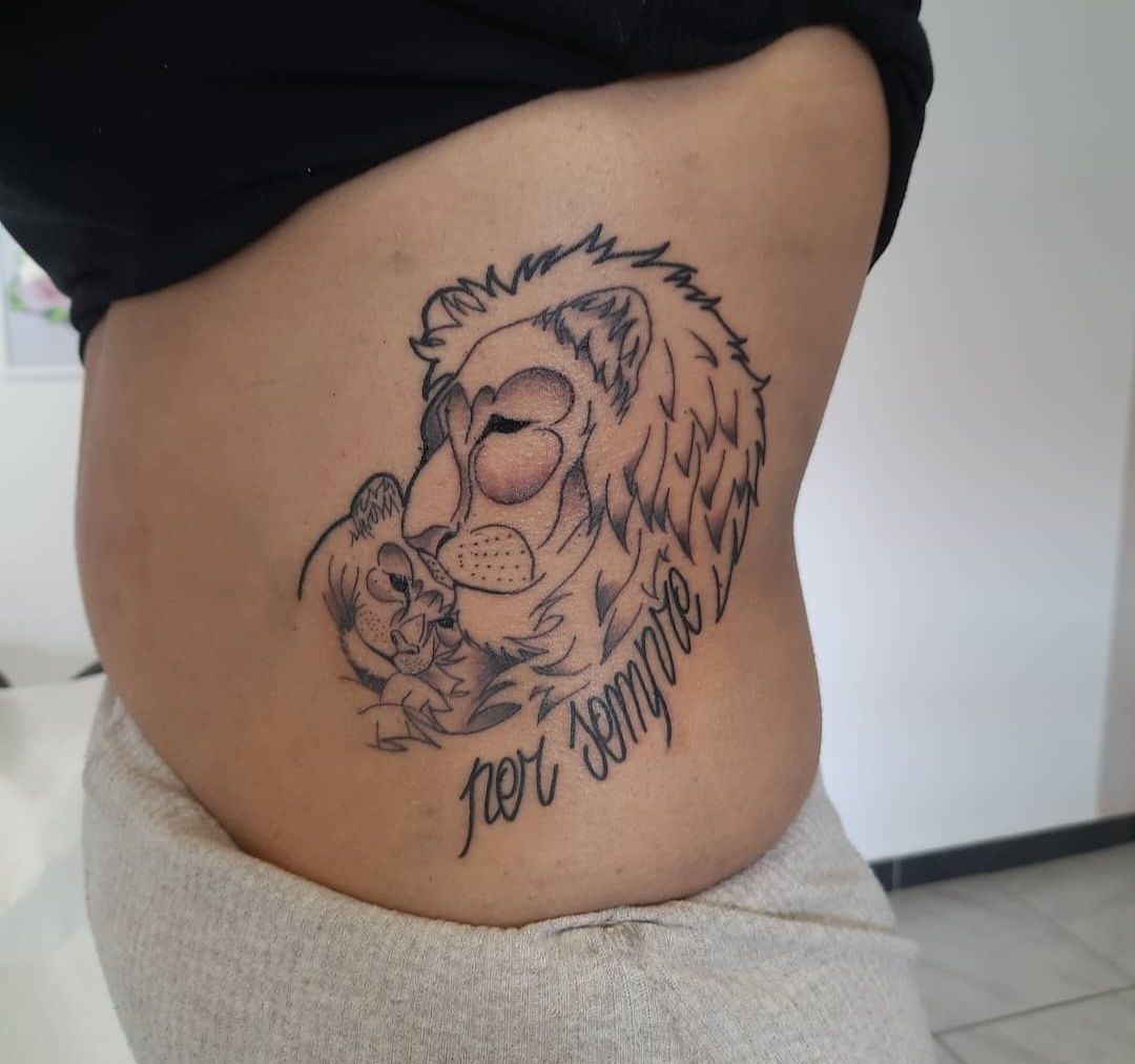 a cover-up tattoo of a lion with the words'be wild ', alzey-worms, germany