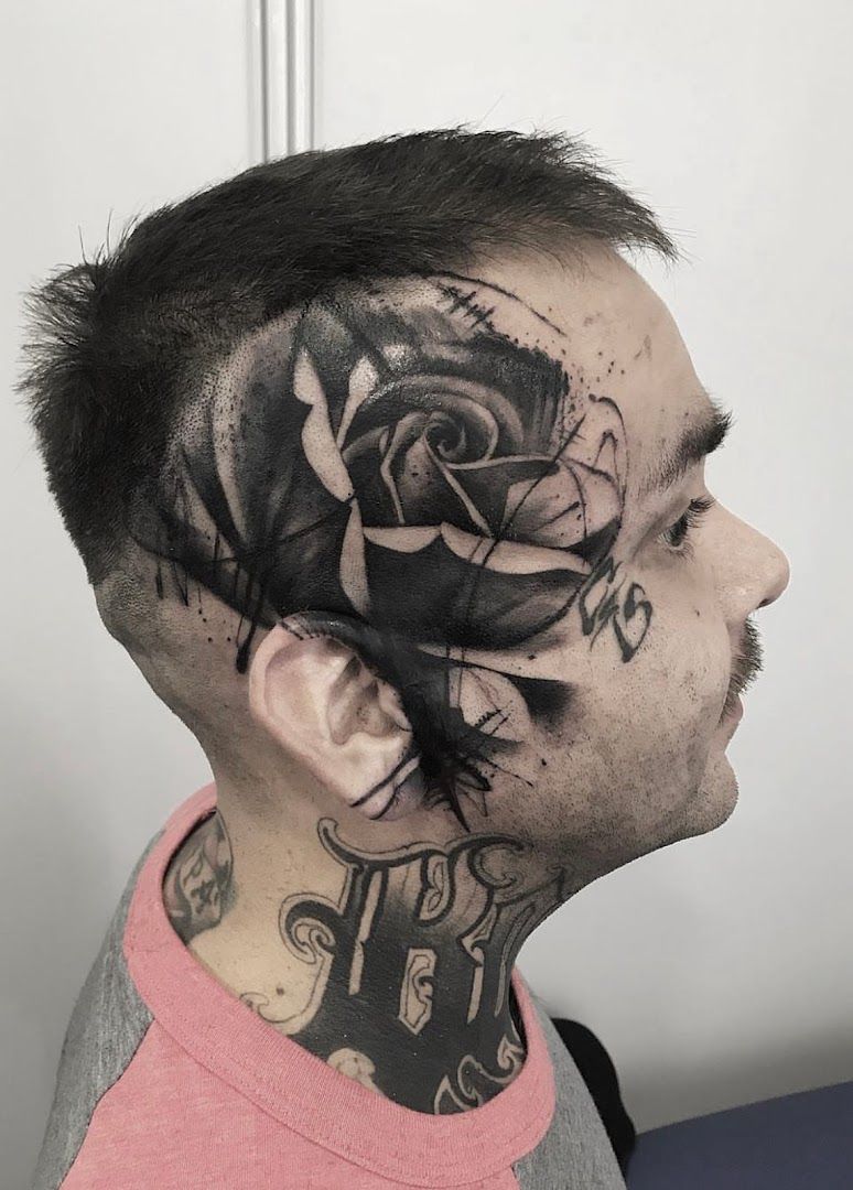 a man with a black rose cover-up tattoo on his neck, bergstraße, germany