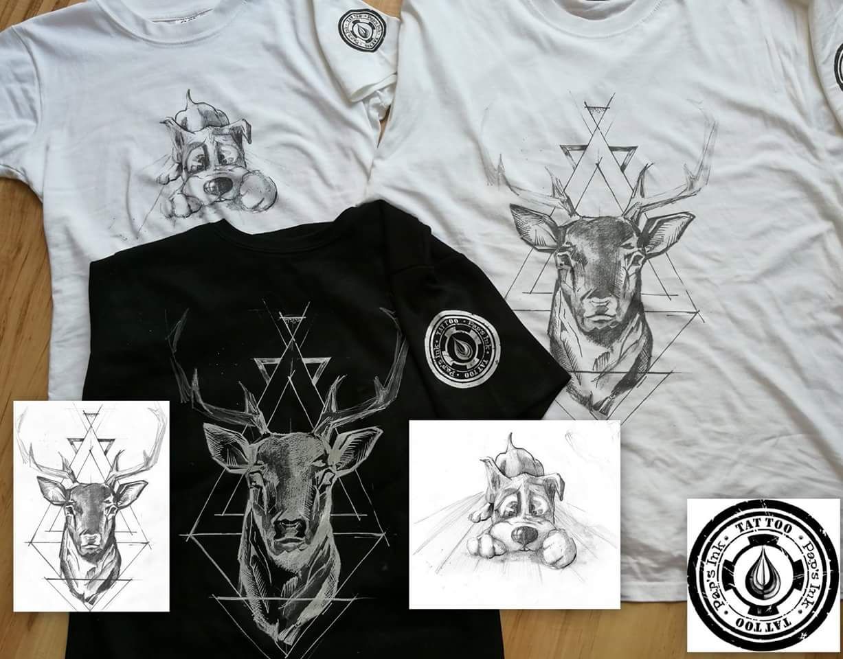 a white shirt with a deer and a triangle on it