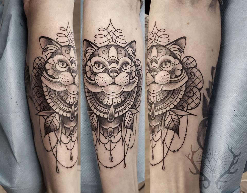 a cat cover-up tattoo on the leg, vogelsbergkreis, germany