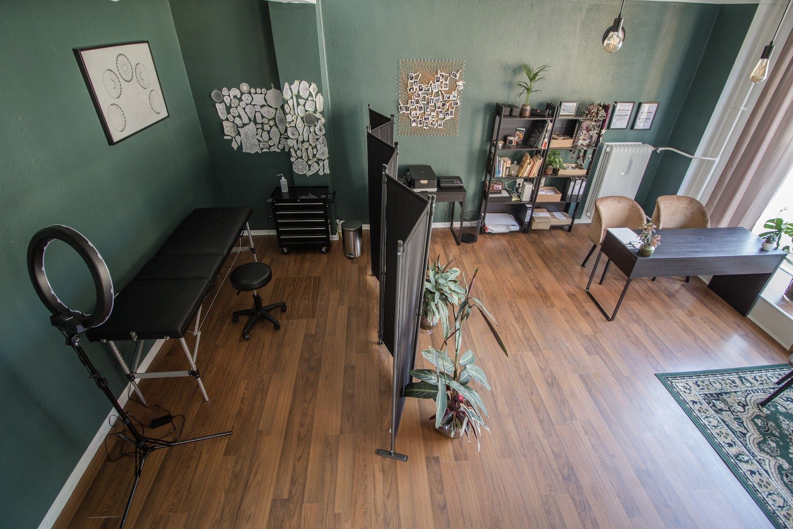 a room with a desk, chair, and computer