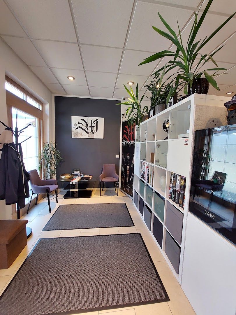 a living room with a tv and a plant