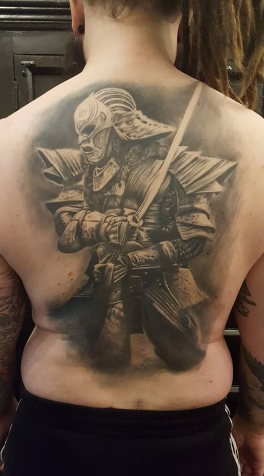 a man with a samurai cover-up tattoo on his back, mönchengladbach, germany