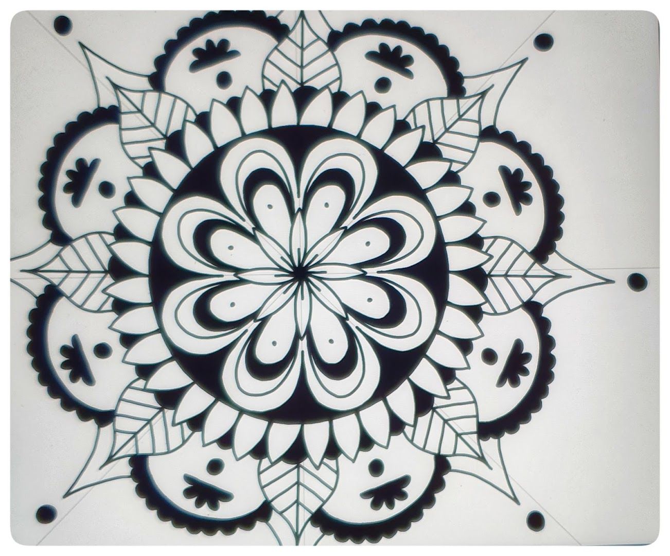 a black and white mandal design on a white background