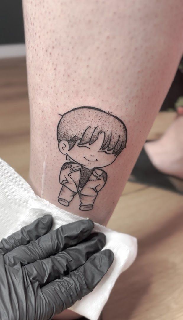 a narben tattoo of a girl with a small tattoo on her leg, rhein-erft district, germany