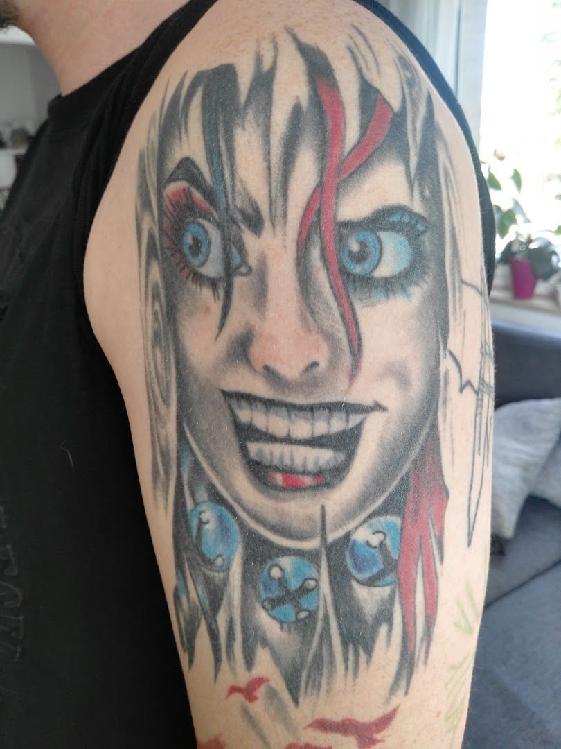 a narben tattoo of a woman with blue eyes and red hair, bochum, germany