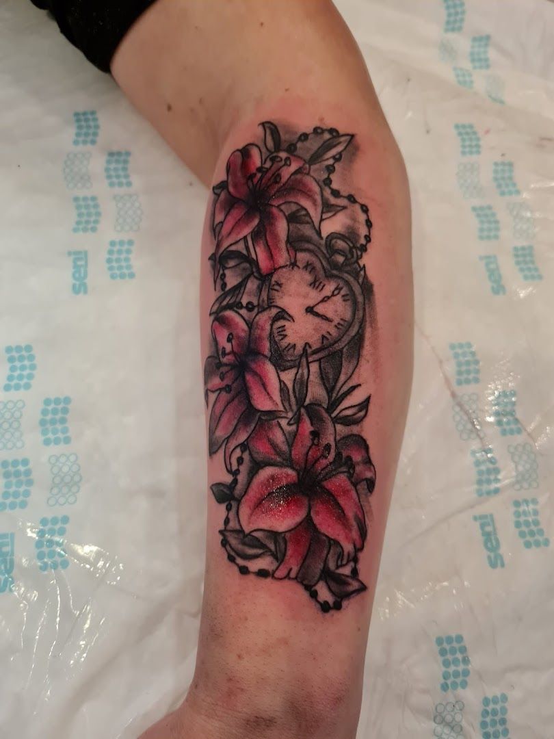 a narben tattoo with flowers on the arm, essen, germany