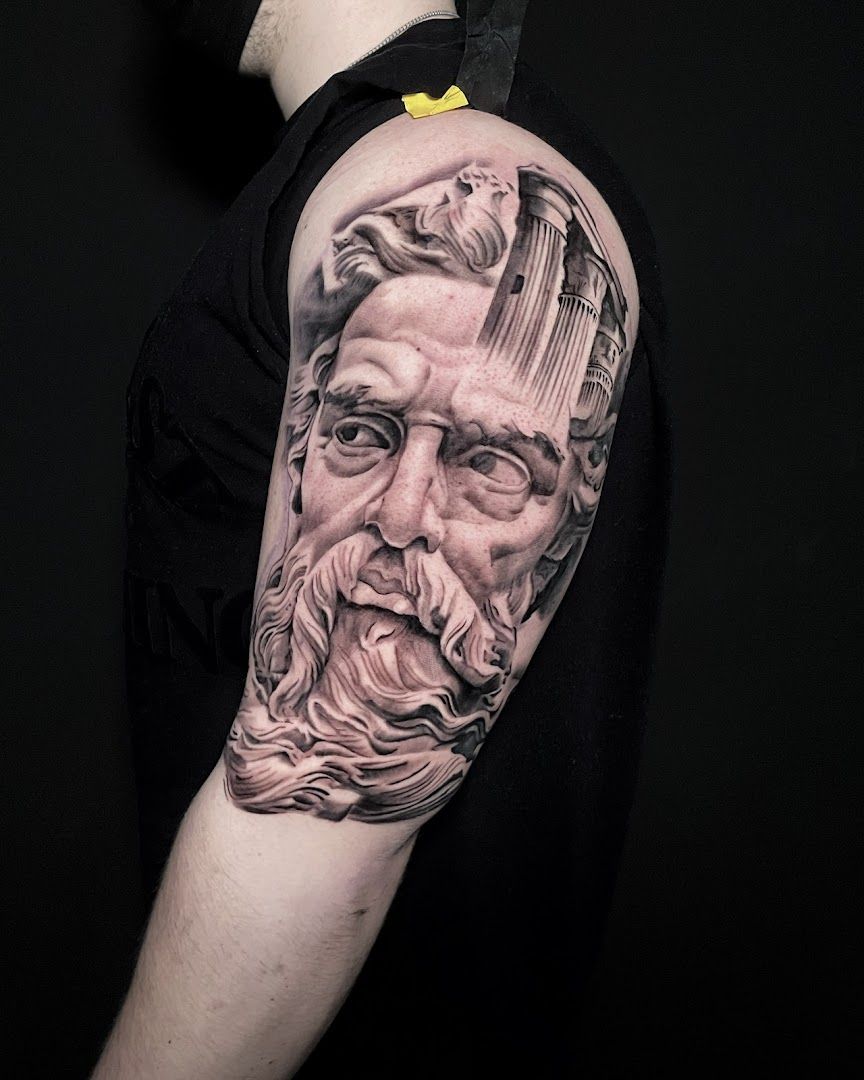 a man with a beard and a beard cover-up tattoo on his arm, pinneberg, germany