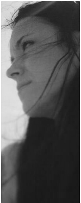 a woman's shadow in the shadows of her hair