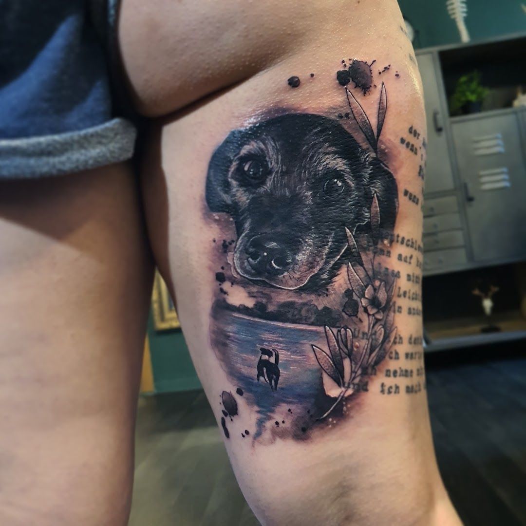 a black and white cover-up tattoo of a dog with a quote, duisburg, germany