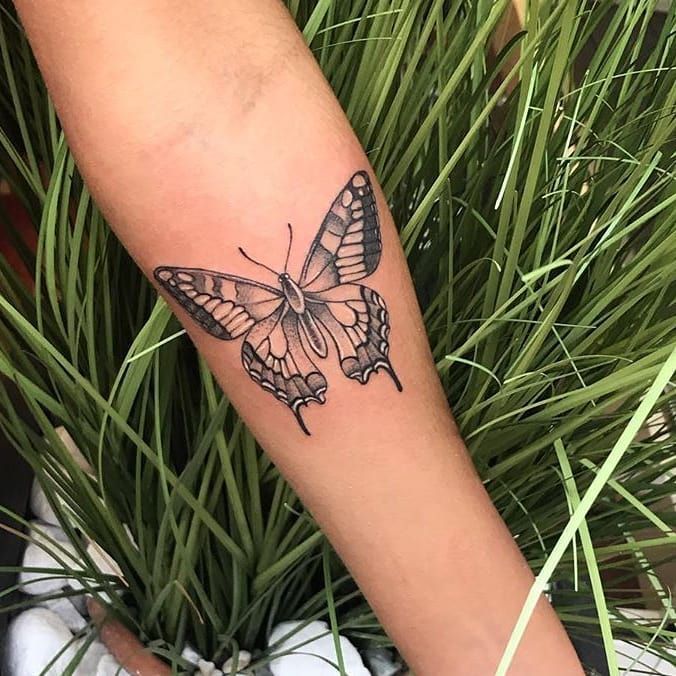 a butterfly narben tattoo on the wrist, bonn, germany
