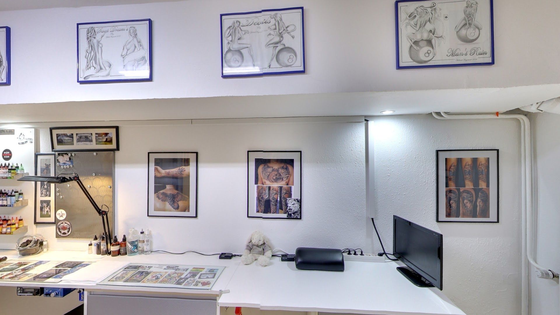 a white desk with a computer and a monitor