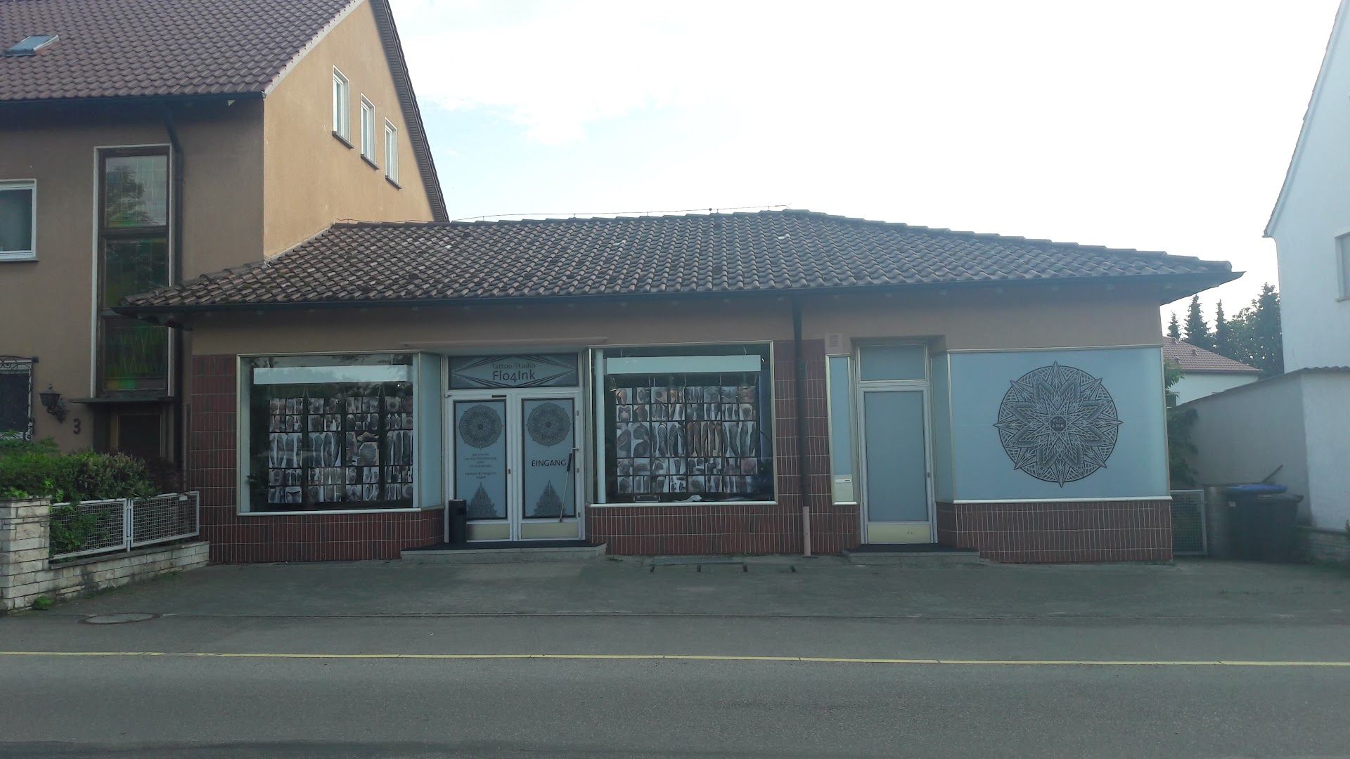 a building with a large window and a sign on the front