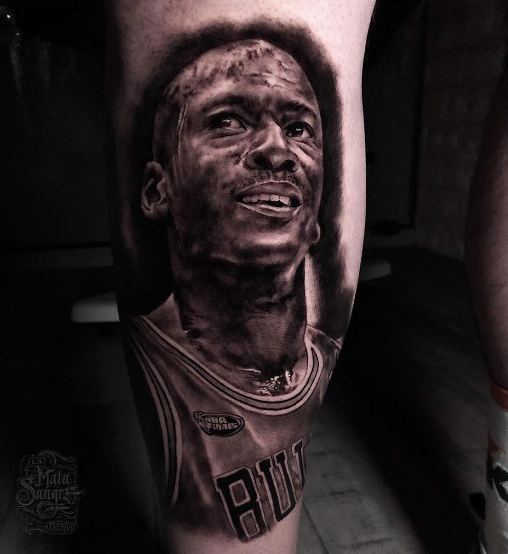 a cover-up tattoo of a basketball player with a black and white face, düsseldorf, germany