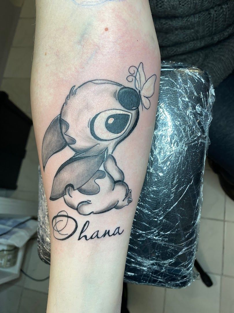 a narben tattoo of a cartoon character with the word's name, osterholz, germany