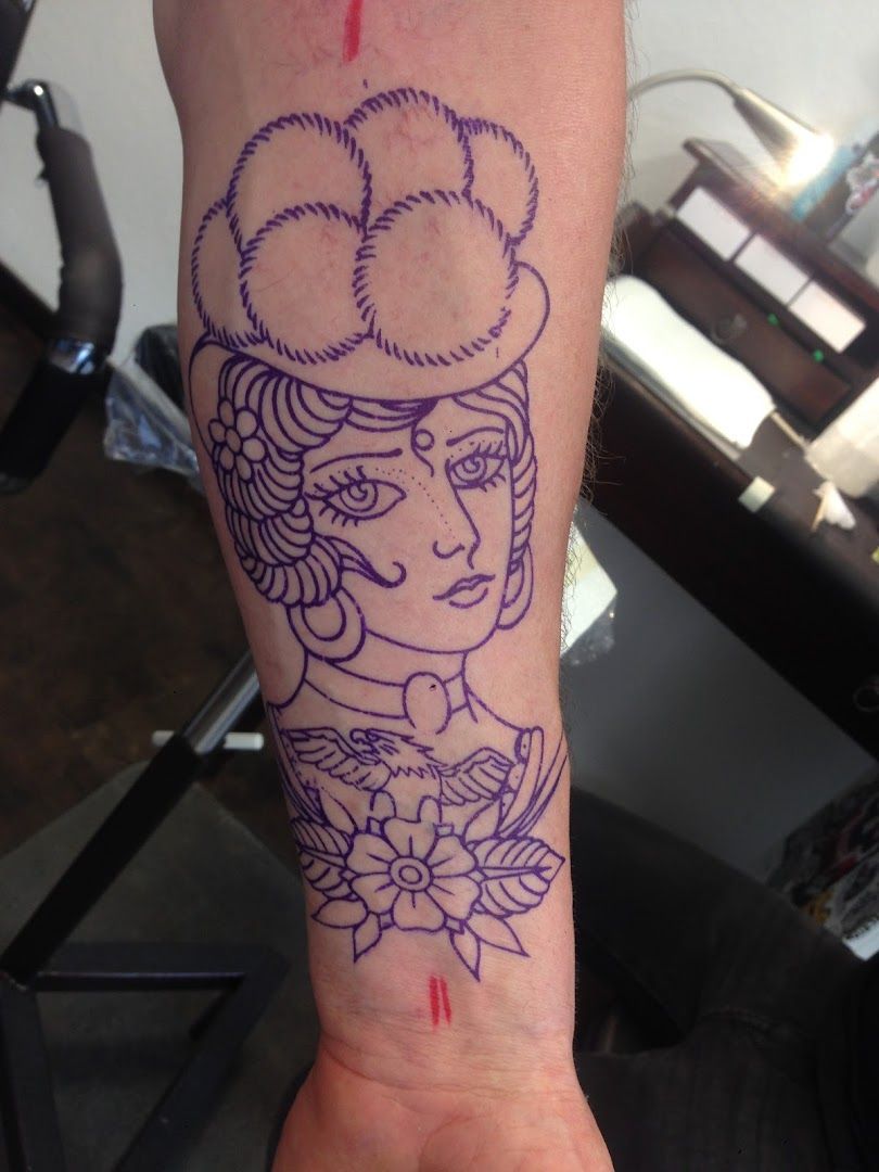a narben tattoo of a girl with a hat on her arm, konstanz, germany