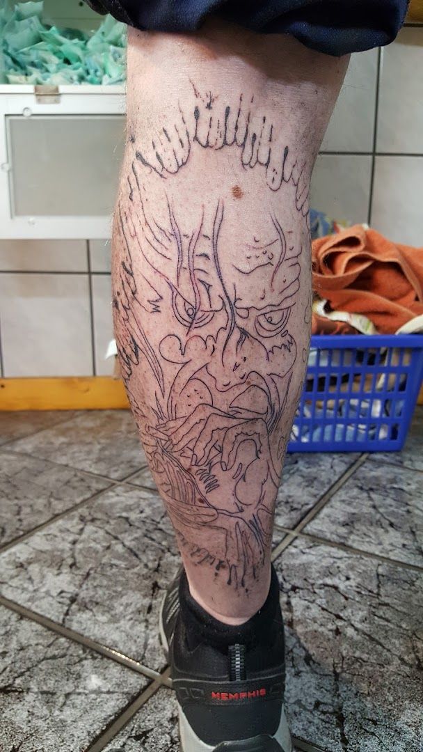 a cover-up tattoo on the leg of a man, weilheim-schongau, germany