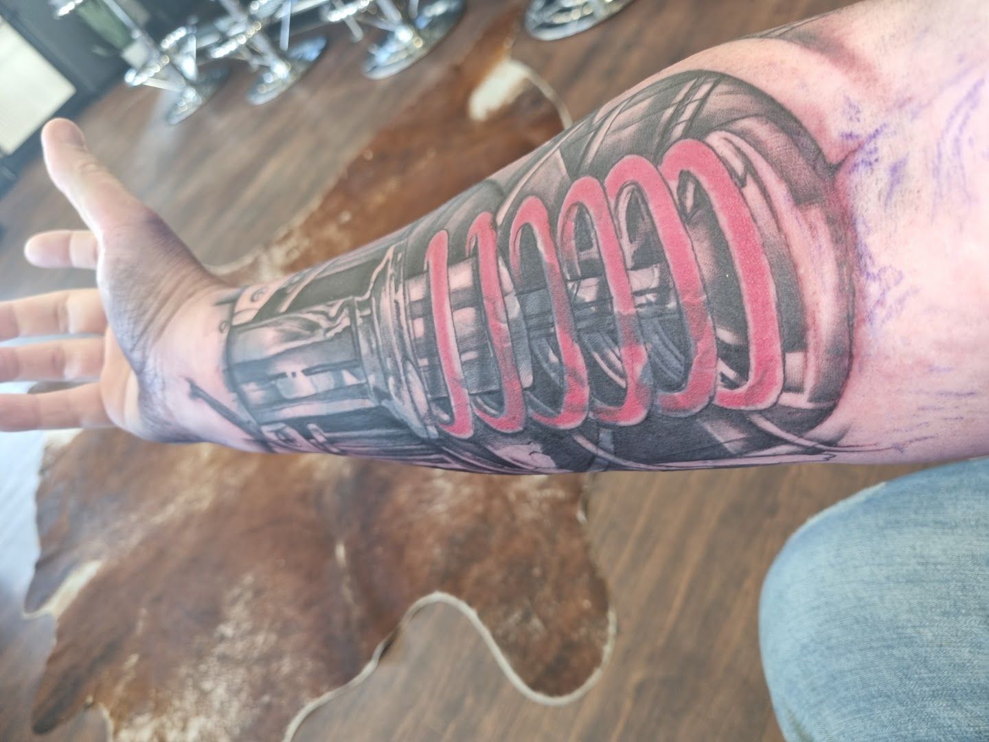 a man's arm with a cover-up tattoo of a coca cola can, warendorf, germany