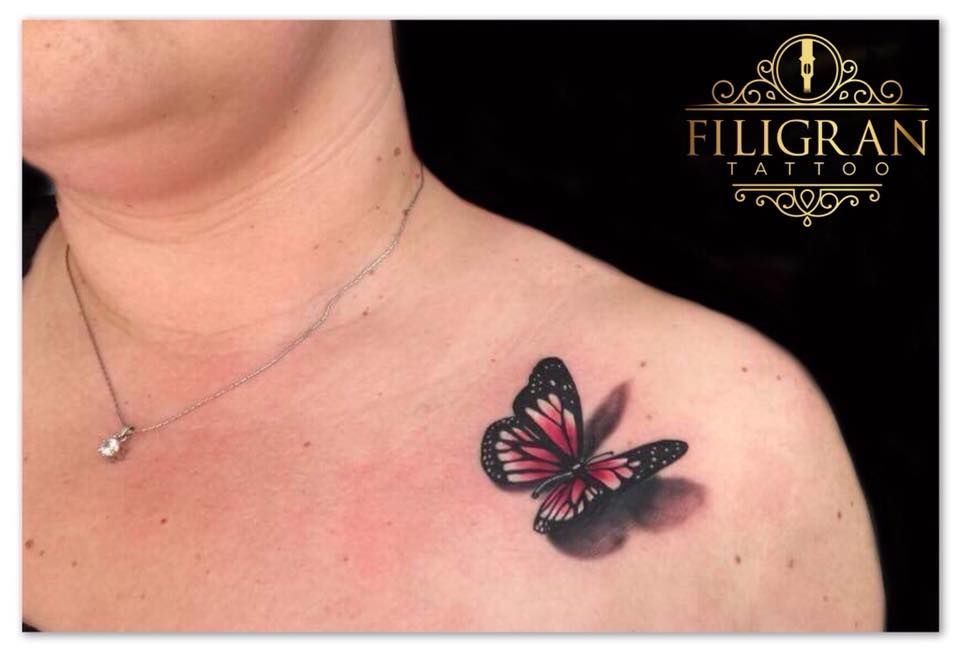 a woman with a butterfly narben tattoo on her chest, offenbach, germany