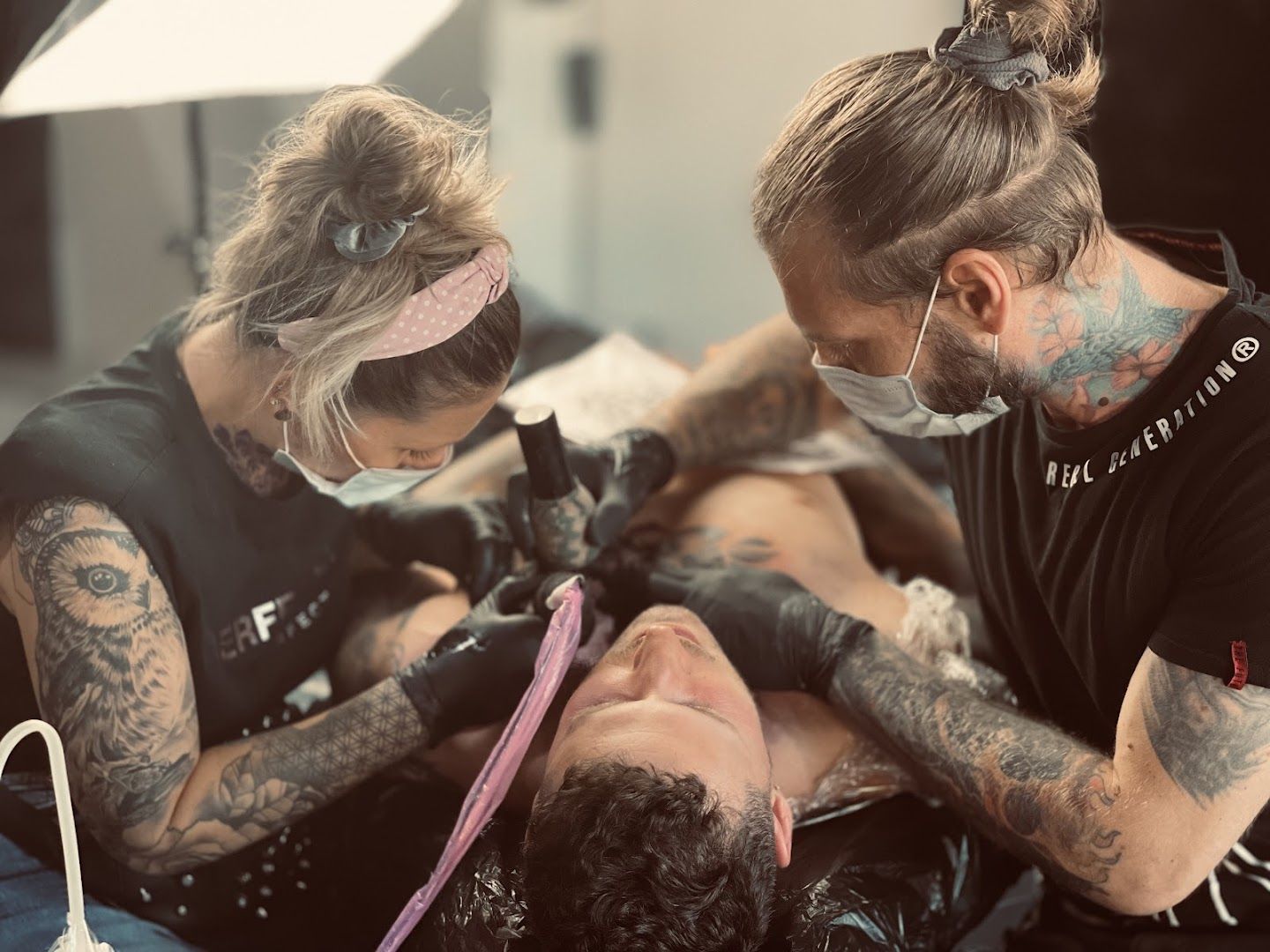 a man getting a narben tattoo on a woman, rhein-erft district, germany