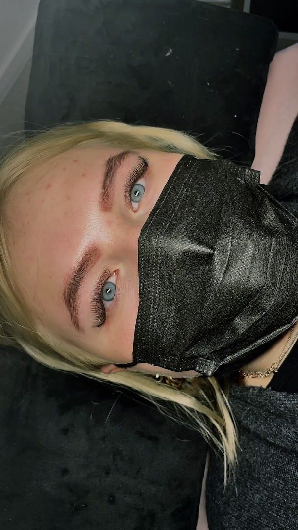 a woman with a black mask on her face