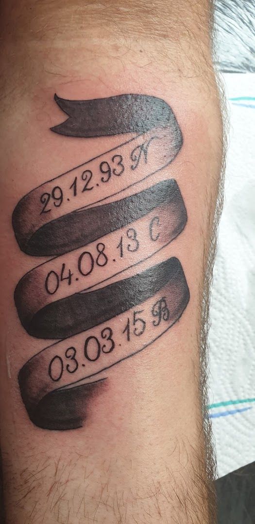 a cover-up tattoo with the date of birth on it, gütersloh, germany