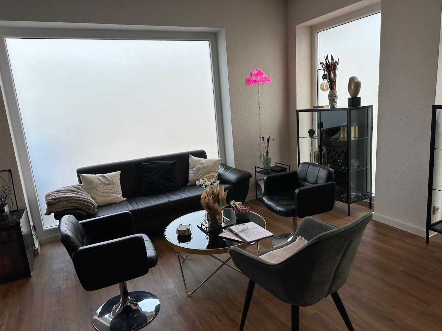 a living room with a couch, chair, and coffee table