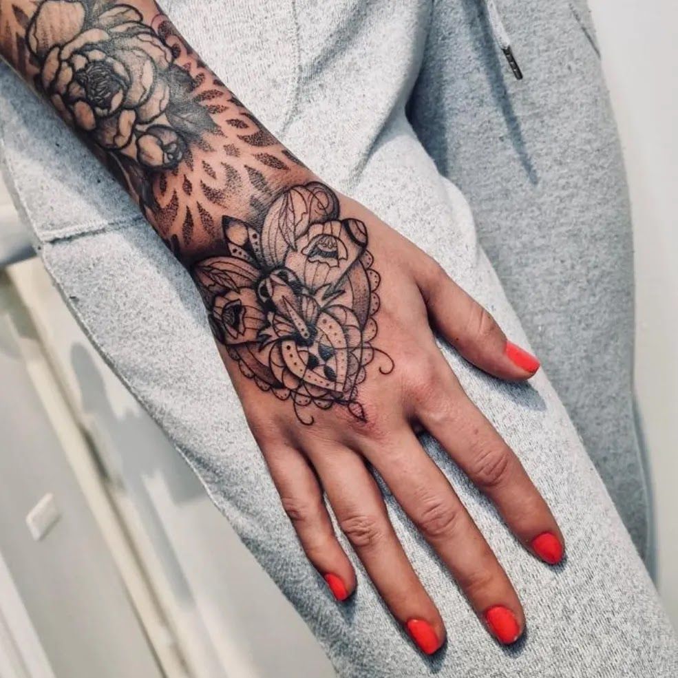 a woman's hand with a japanische tattoos in leipzig on it, göppingen, germany