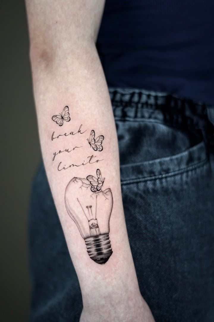 a light bulb cover-up tattoo on the arm, bodenseekreis, germany