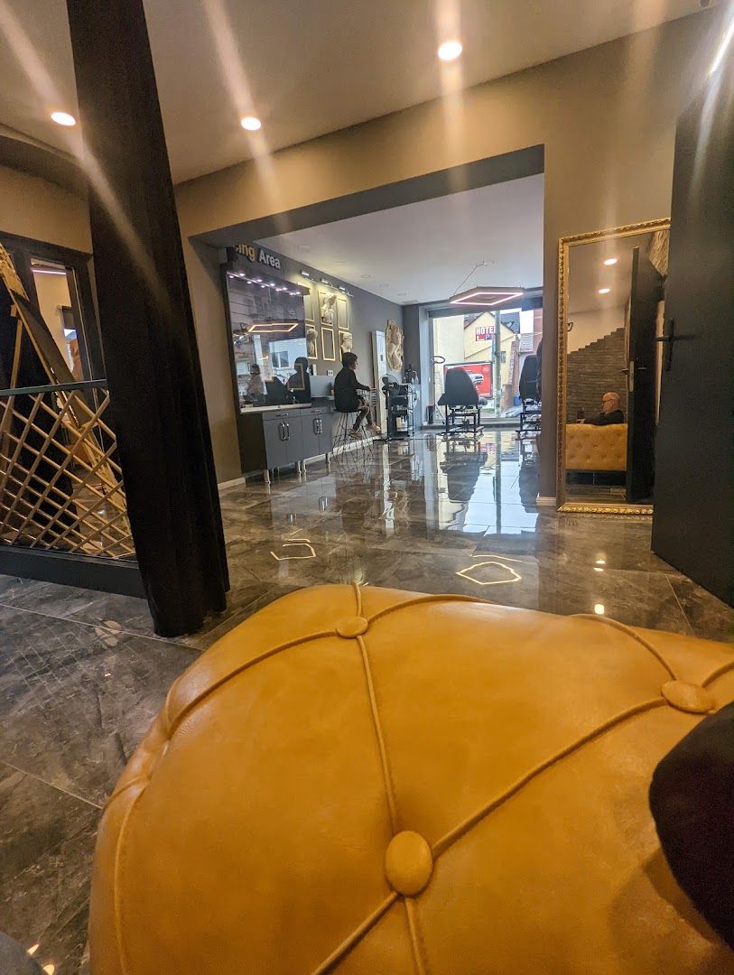 a large yellow leather ottoman in a lobby