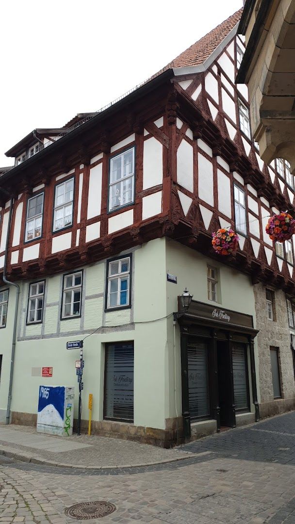 a building with a red and white roof