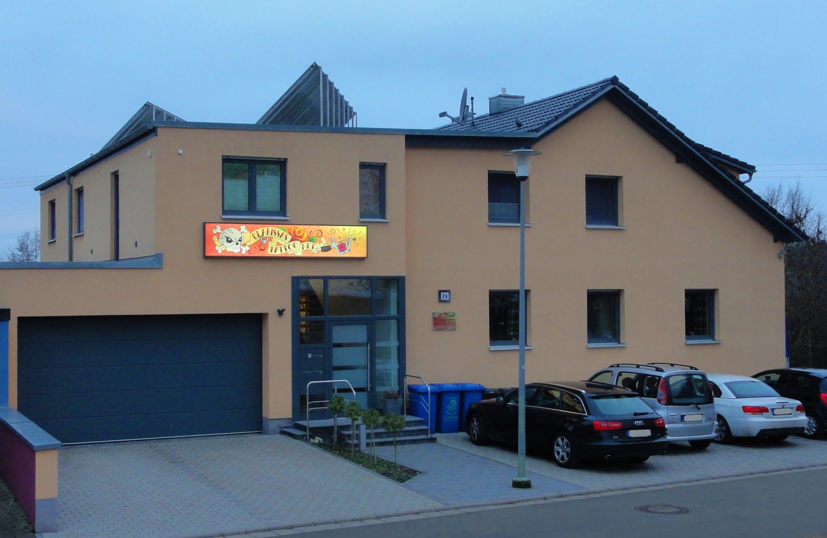 a yellow building with a sign on the side