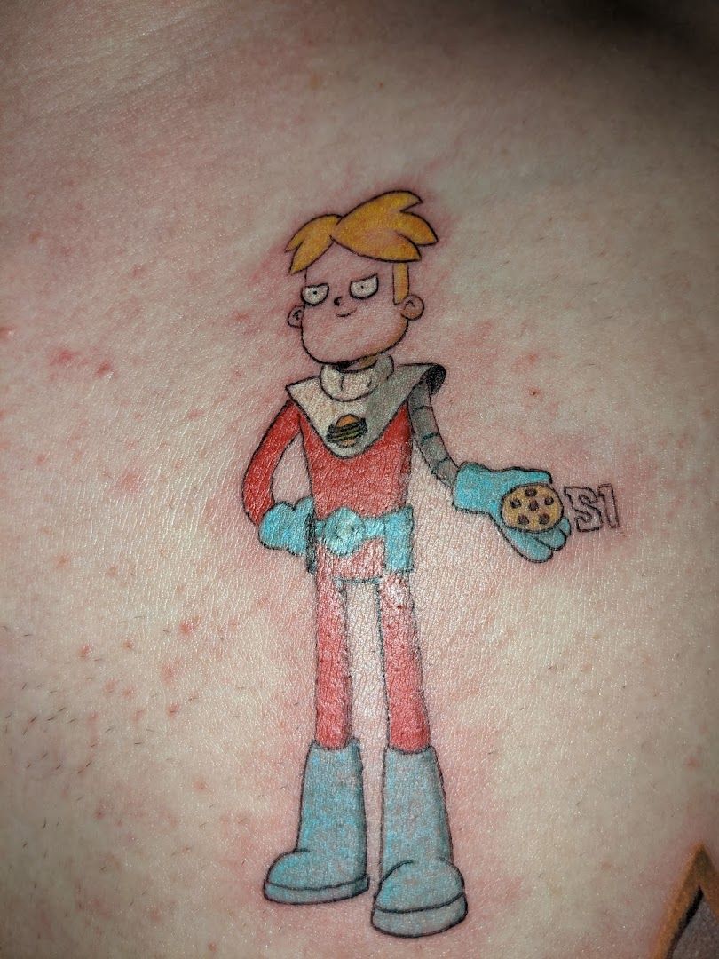 a cartoon character narben tattoo on the back of a woman, göttingen, germany