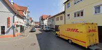 a yellow truck is parked on the side of a street