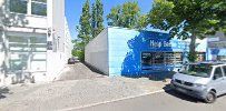 a white building with a blue sign on the side