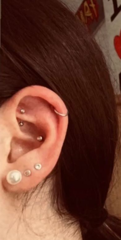 a woman with a piercing on her ear