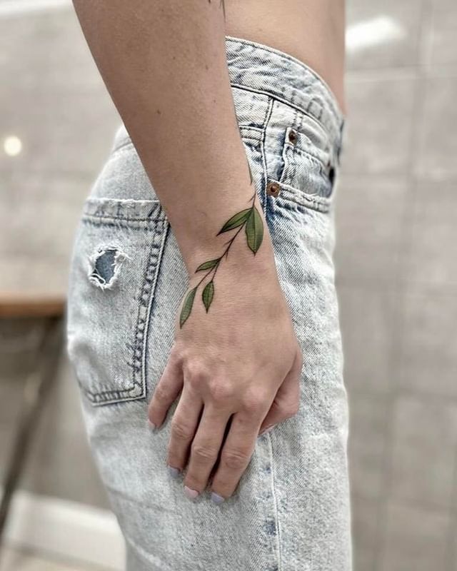 a woman with a cover-up tattoo on her arm, berlin, germany