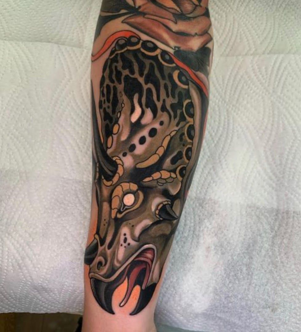 a narben tattoo of a leopard with a black and orange color, bielefeld, germany