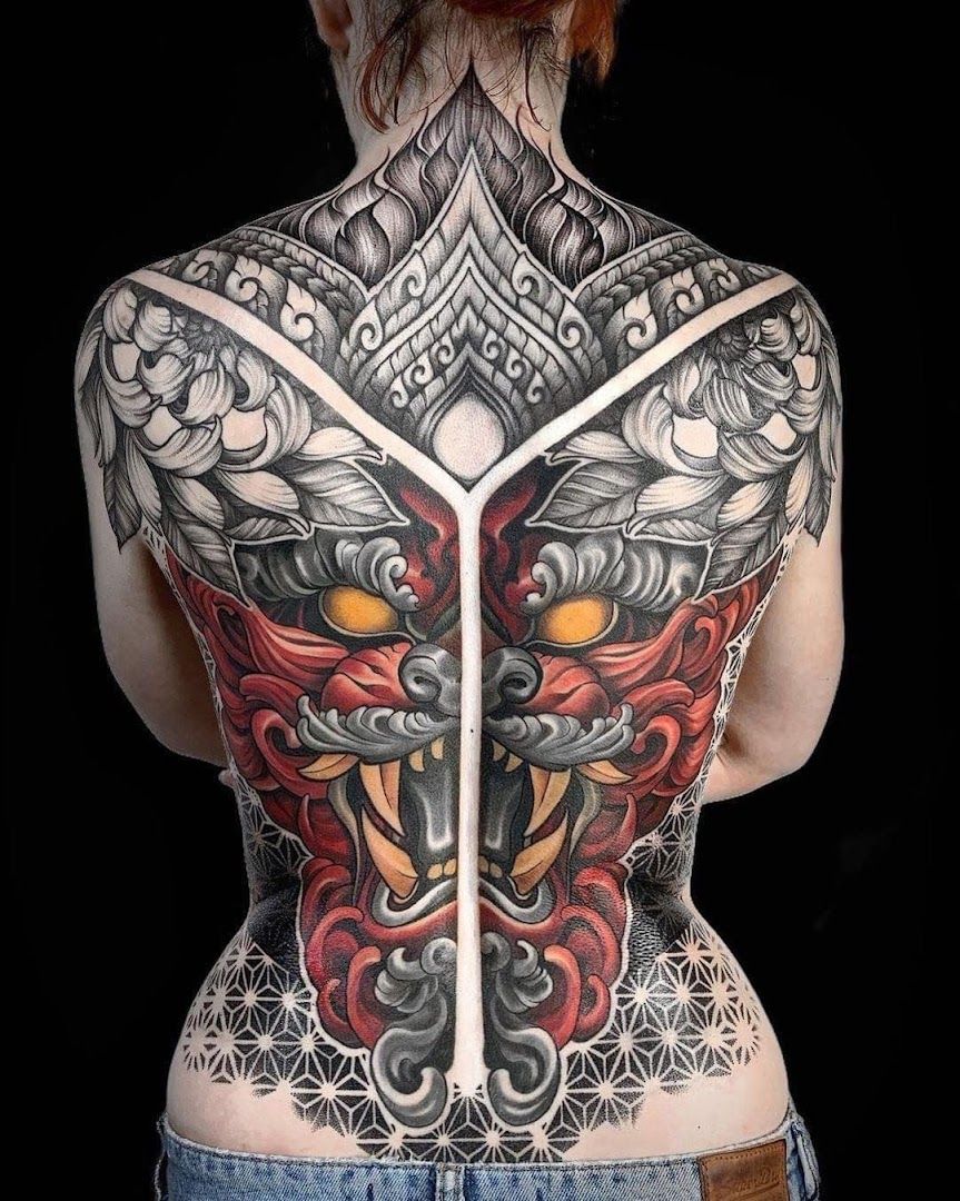 a woman with a cover-up tattoo on her back, berlin, germany