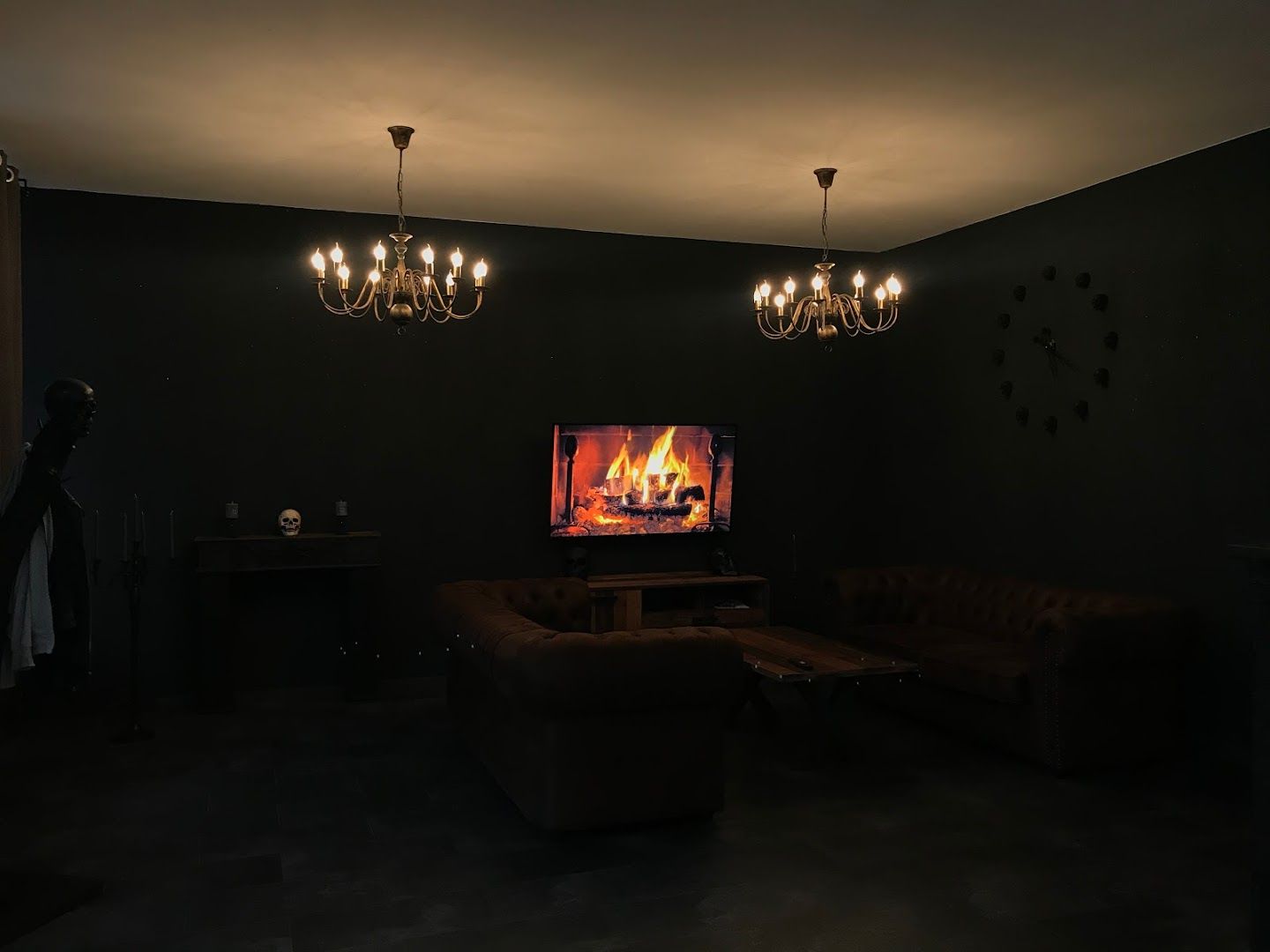 a living room with a couch, chair and fireplace