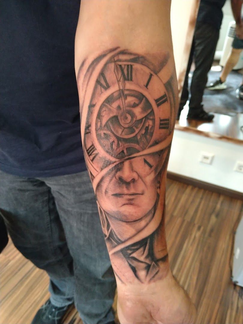 a man with a clock narben tattoo on his arm, rhein-neckar-kreis, germany